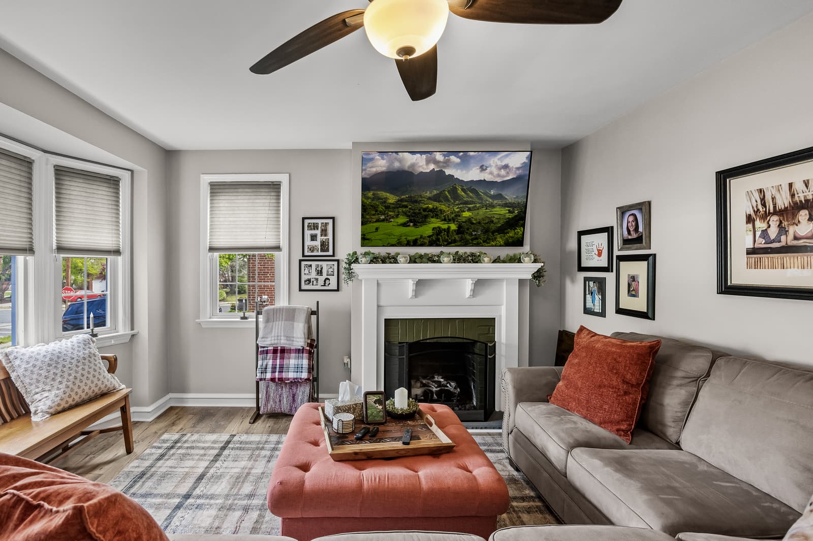 Living room with a brick fireplace and sectional in Haddon Township, NJ