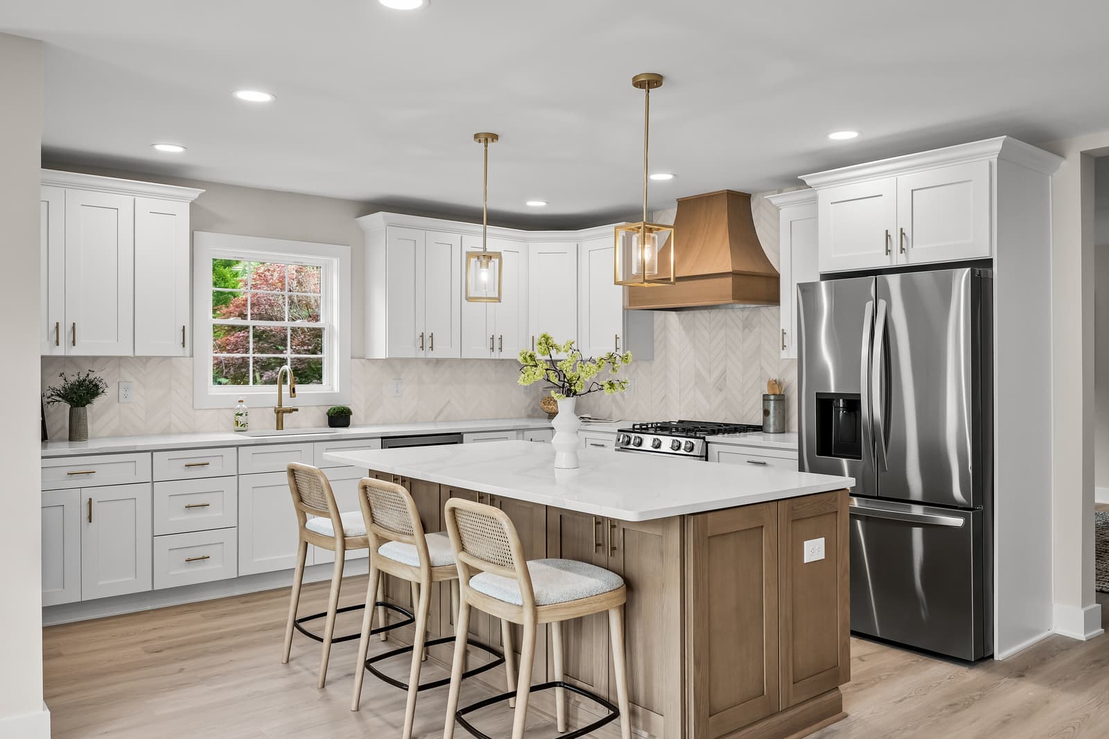 Modern white kitchen with a gray island in Haddon Township, NJ