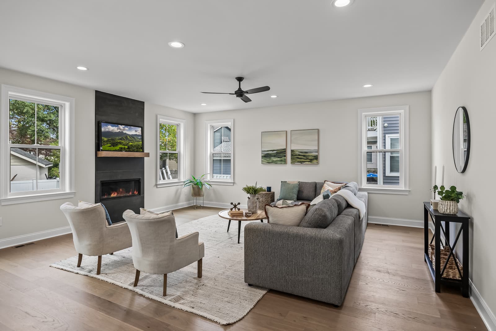Living room with a fireplace and neutral furnishings in a Haddon Township, NJ home