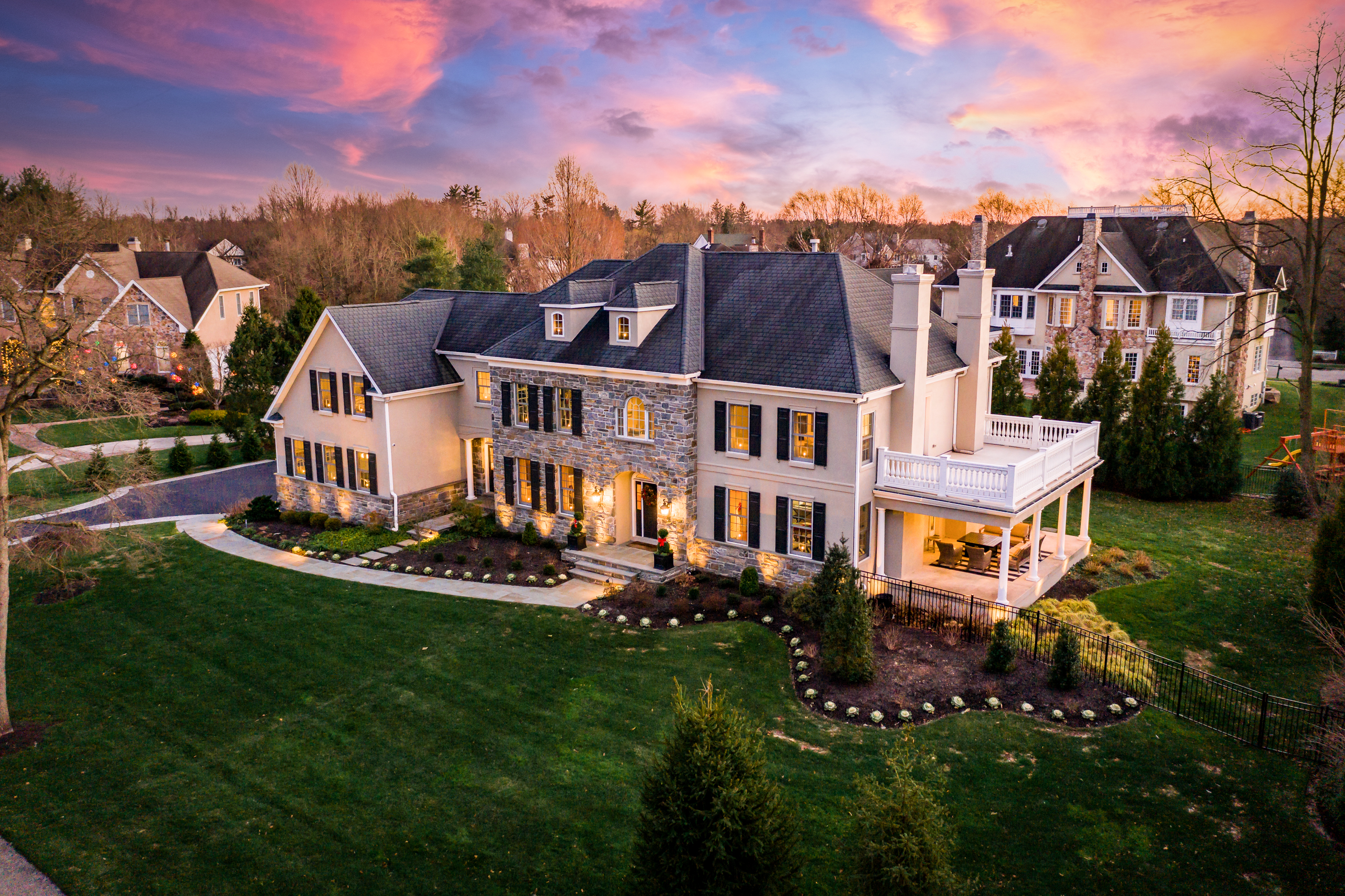 Twilight real estate photography of a stately South Jersey home glowing at dusk