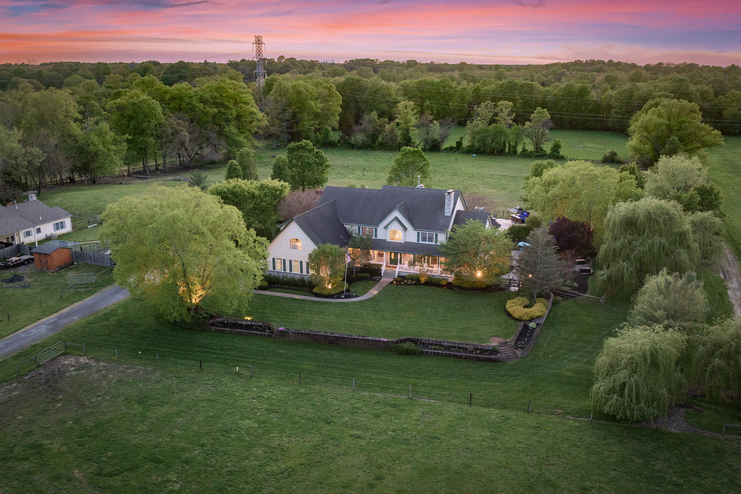 Twilight aerial of a South Jersey country estate at dusk