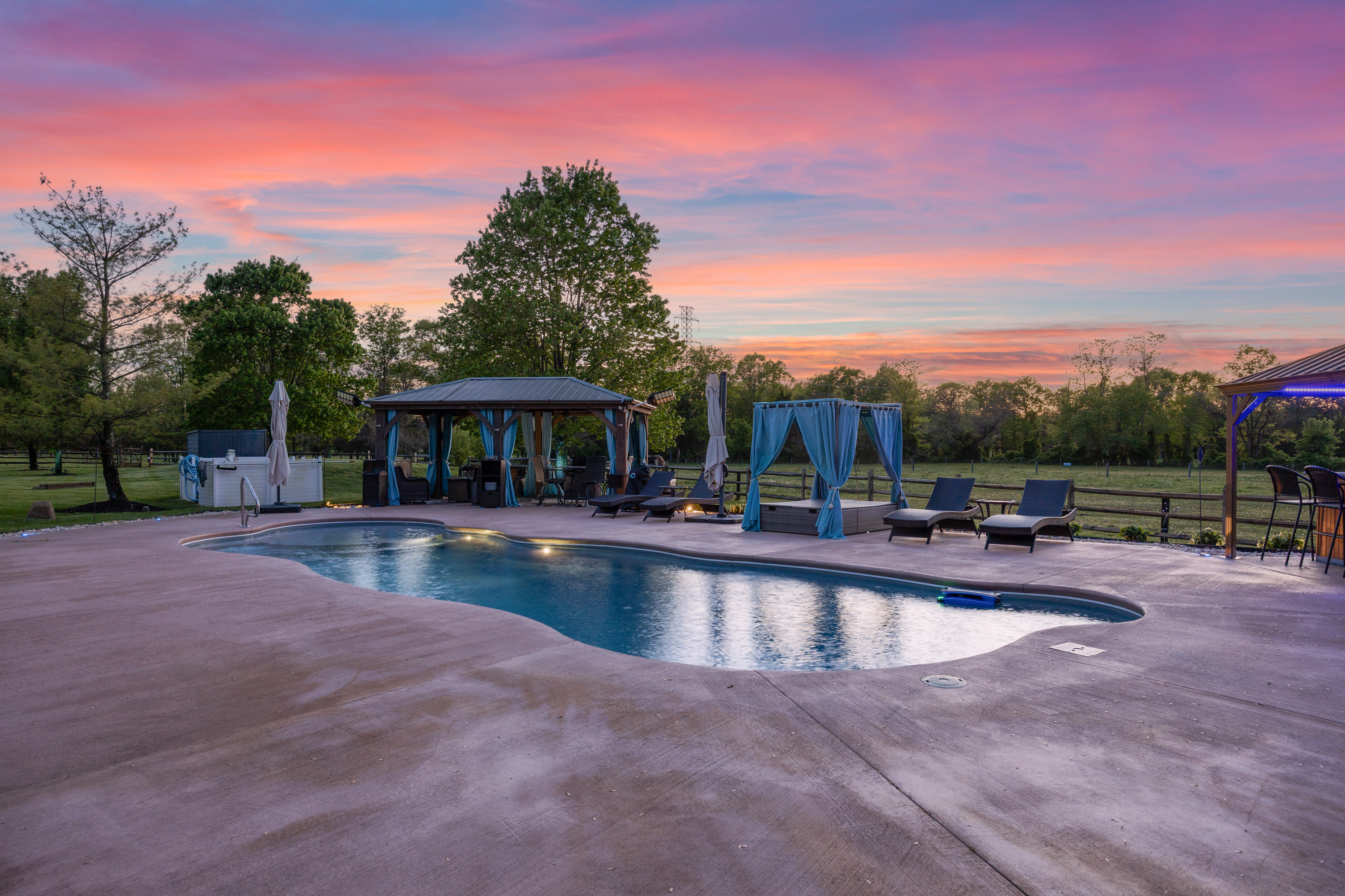 Twilight backyard pool and cabana at sunset, South Jersey